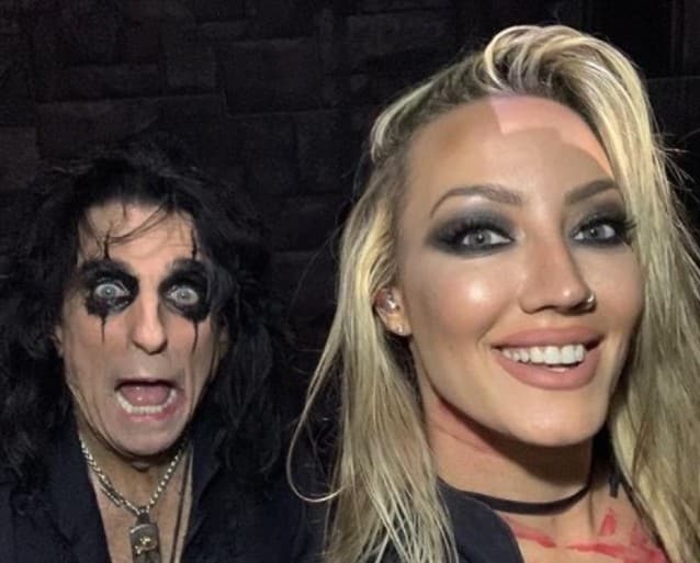 Video: ALICE COOPER Guitarist NITA STRAUSS Gets Hit In The Head By Broken Cane Piece On-Stage